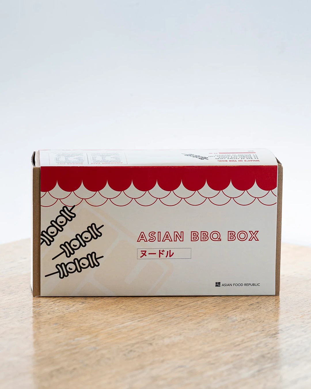 Box red and white with Asian BBQ on it