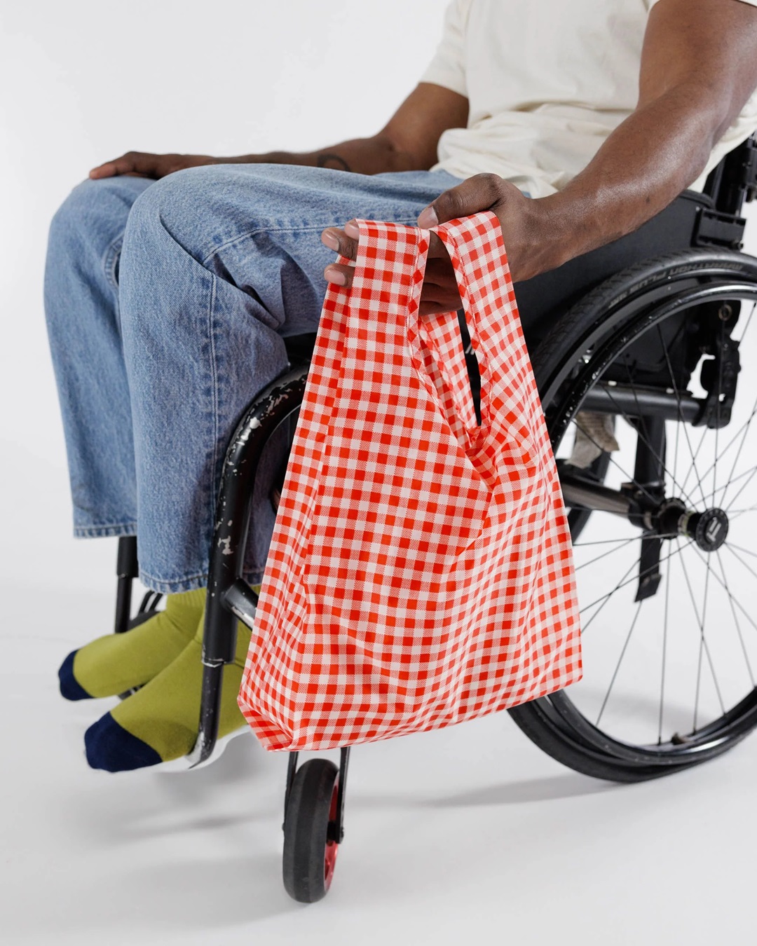 Red gingham bag on wheelchair