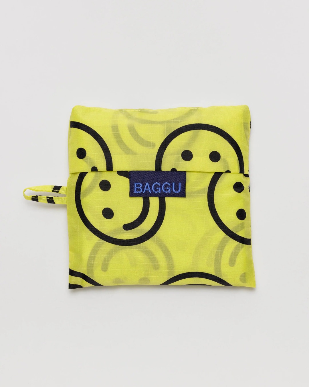 Yellow smiley face bag folded