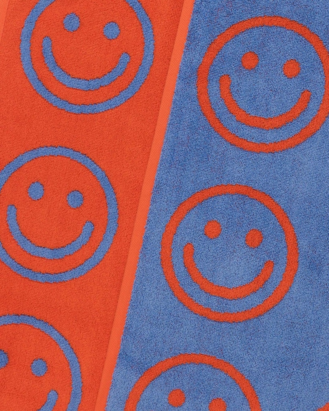 Blue and red smiley face towel