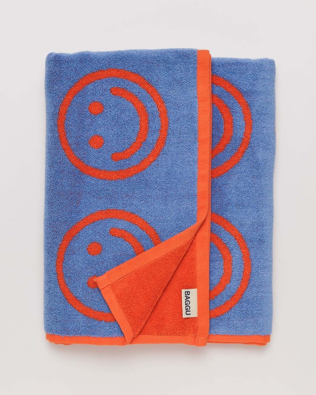 Blue and red smiley face towel