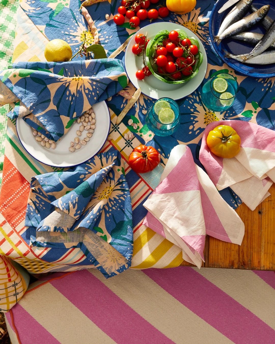 Colourful dining table with food, table cloth, napkins and food