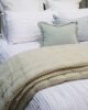 Natural Velvet coverlet on bed