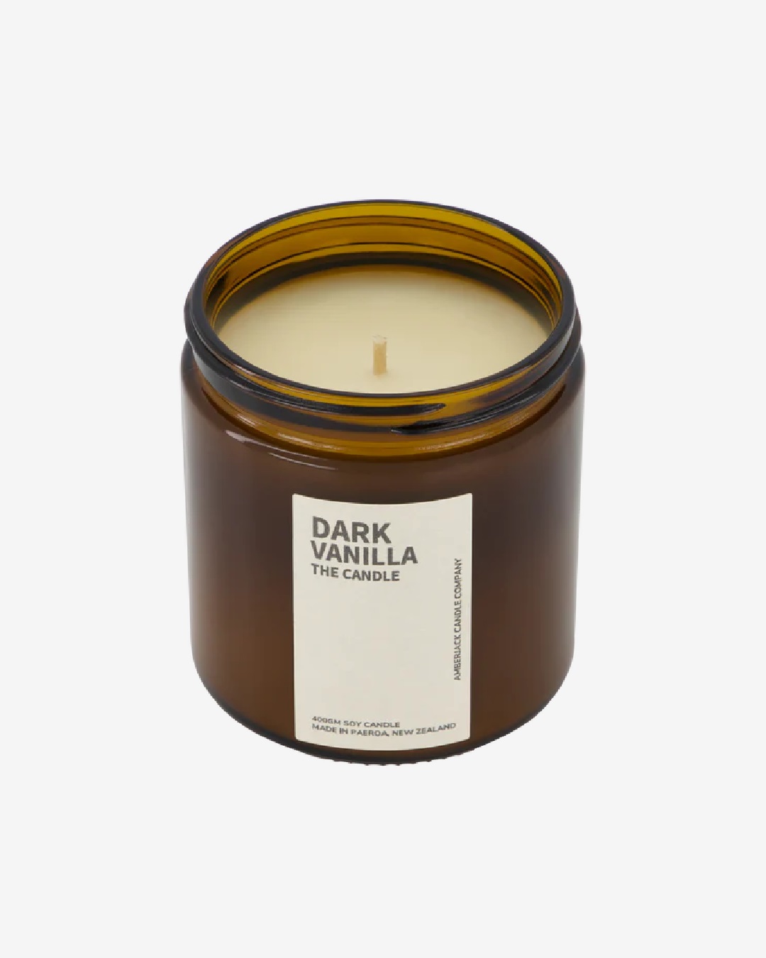 Dark vanilla candle in amber jar