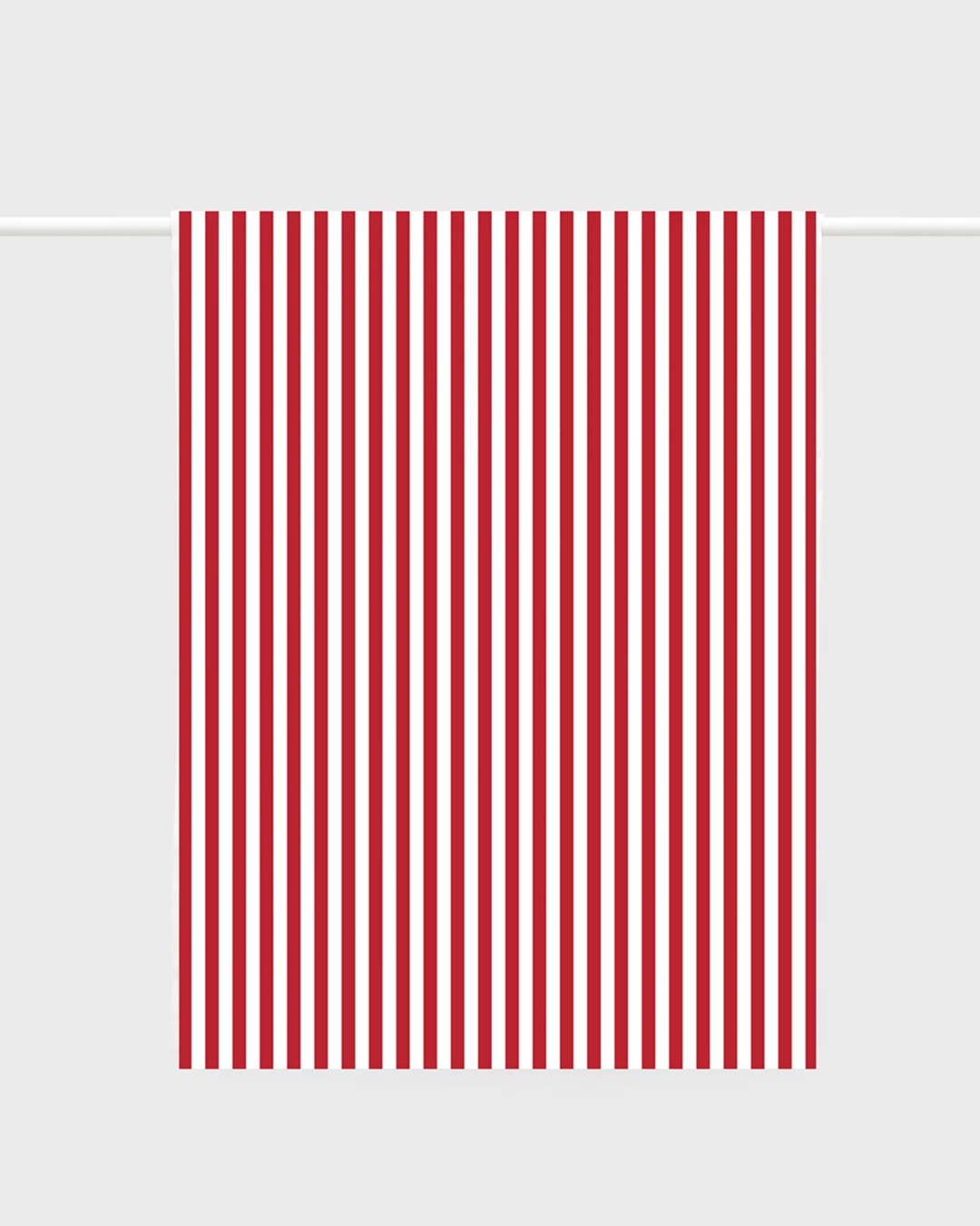 red and white stripe tea towel hanging on a rail