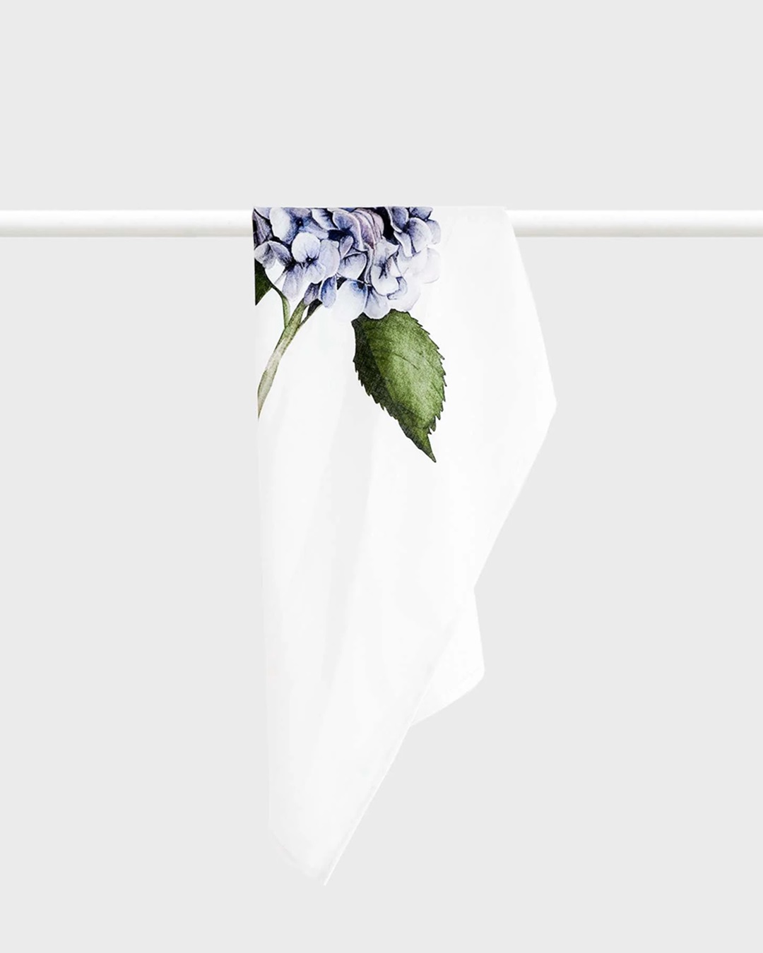 hydrangea and white tea towel hanging on a rail