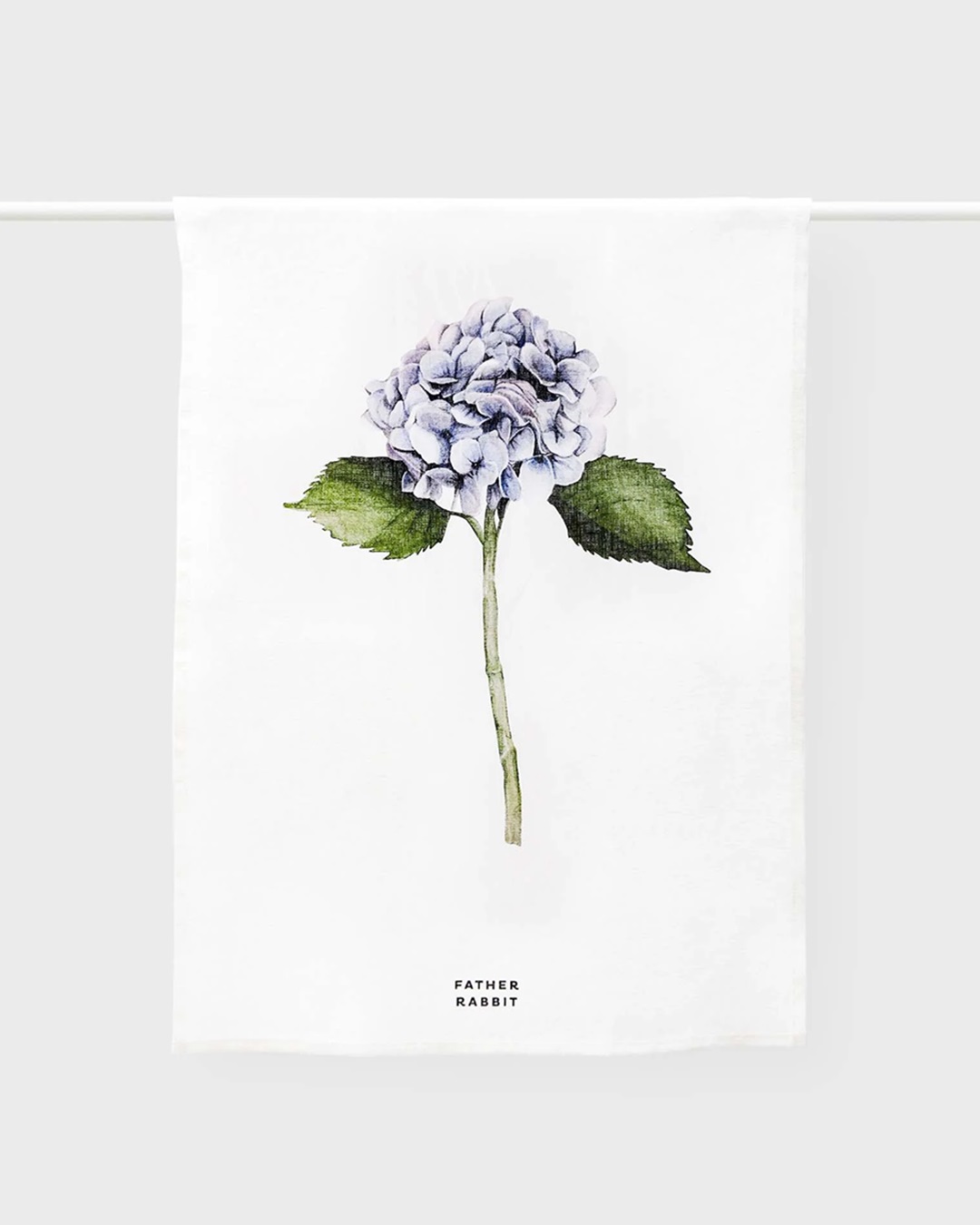 hydrangea and white tea towel hanging on a rail