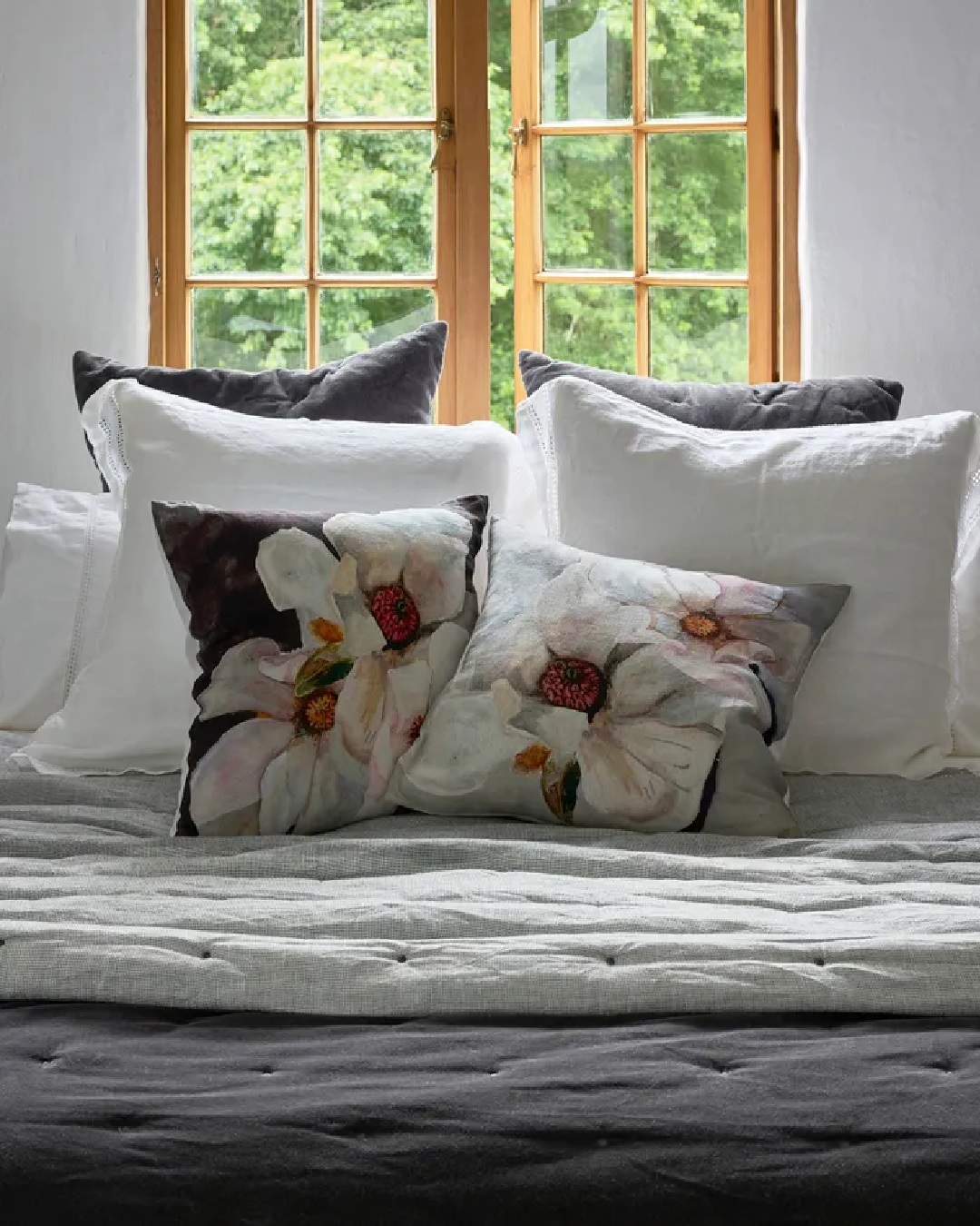 Magnolia flower cushions on bed