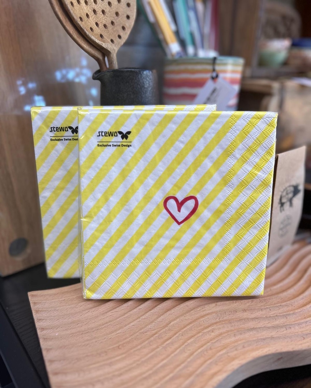 Yellow stripe napkins with pink heart in packet