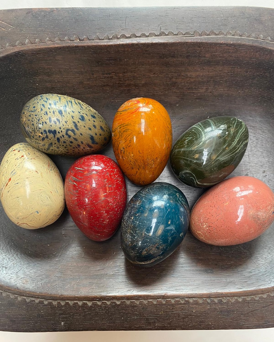 Colourful painted eggs in a bowl