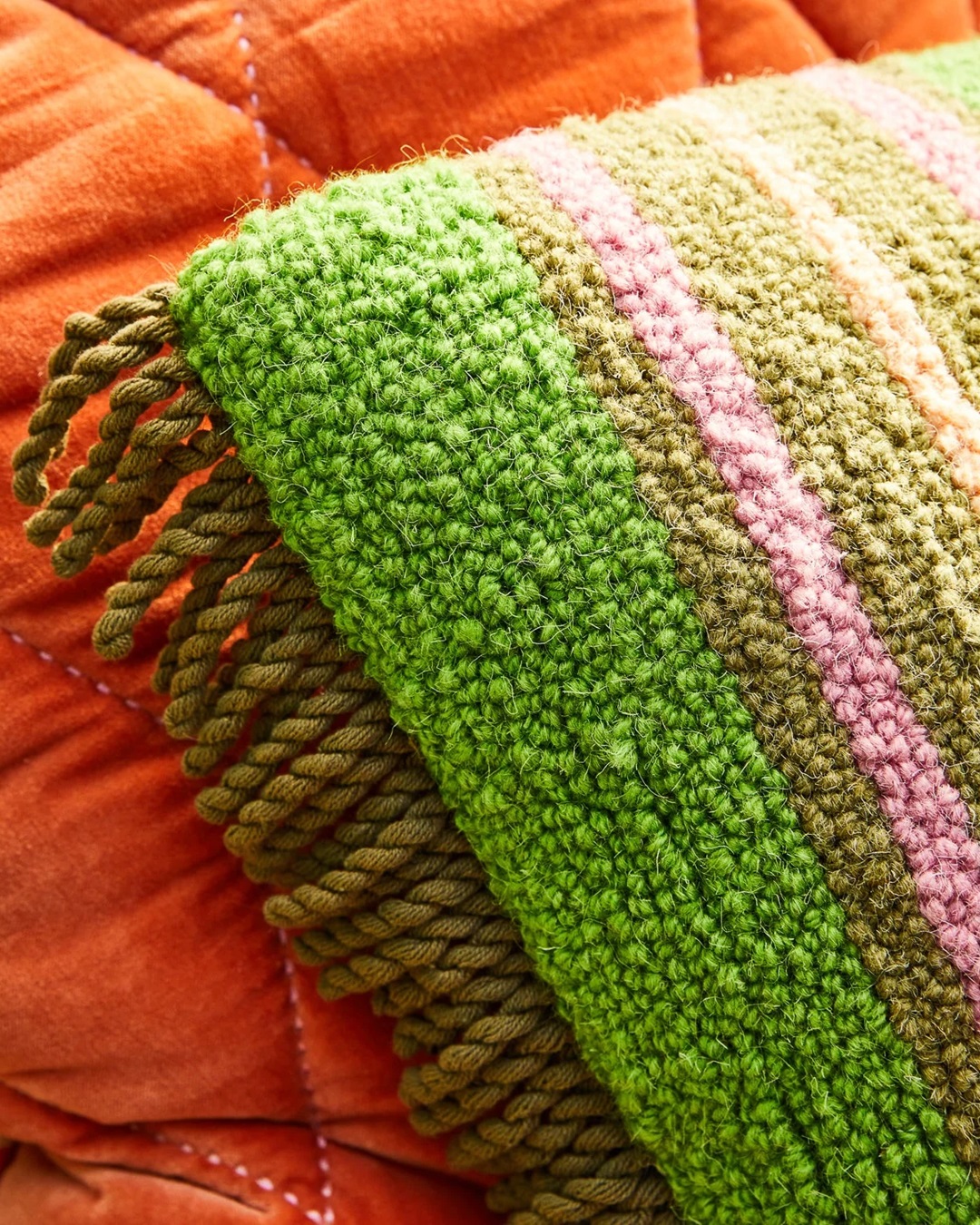 Green and pink stripe rectangle cushion with fringe