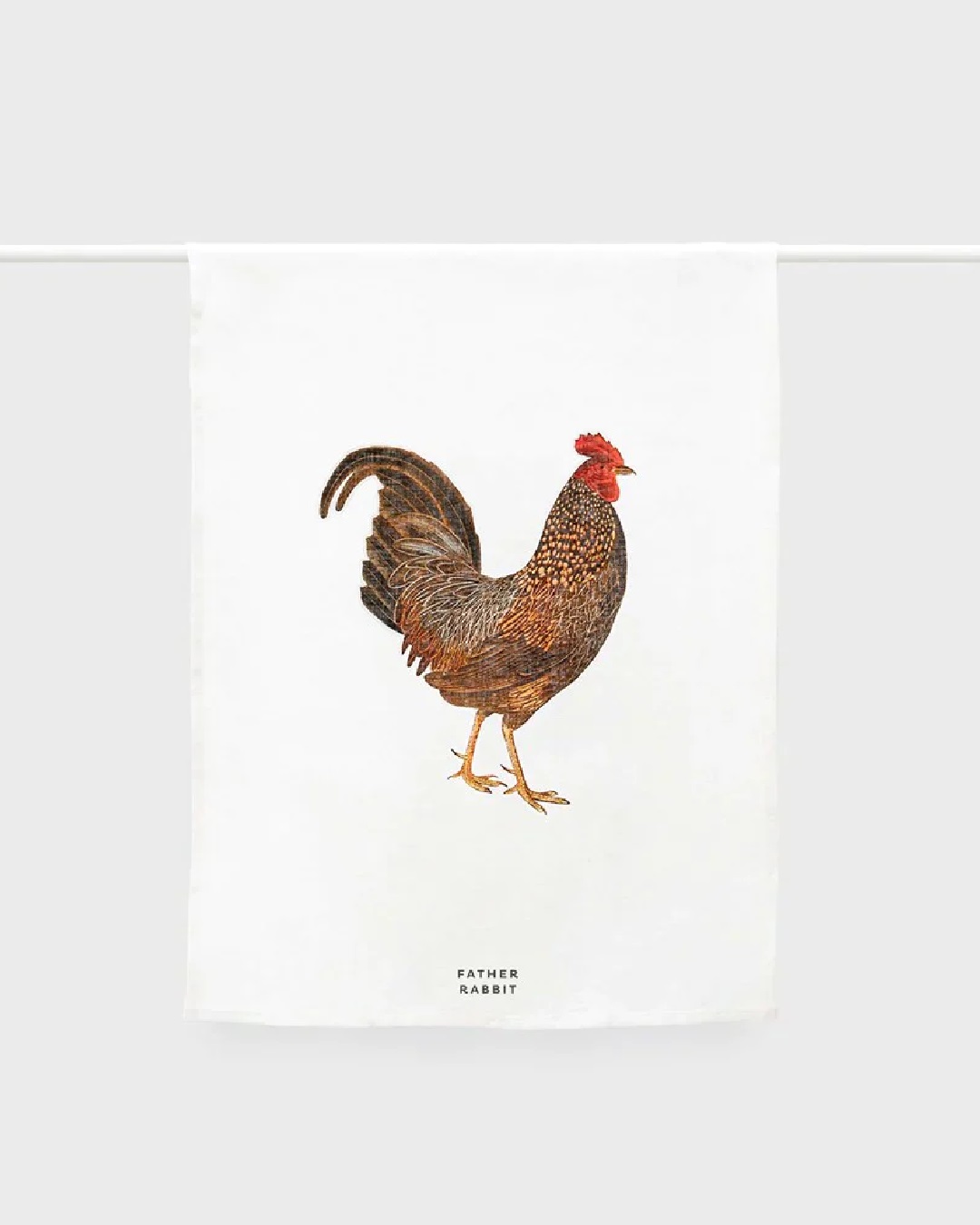 rooster and white tea towel hanging on a rail