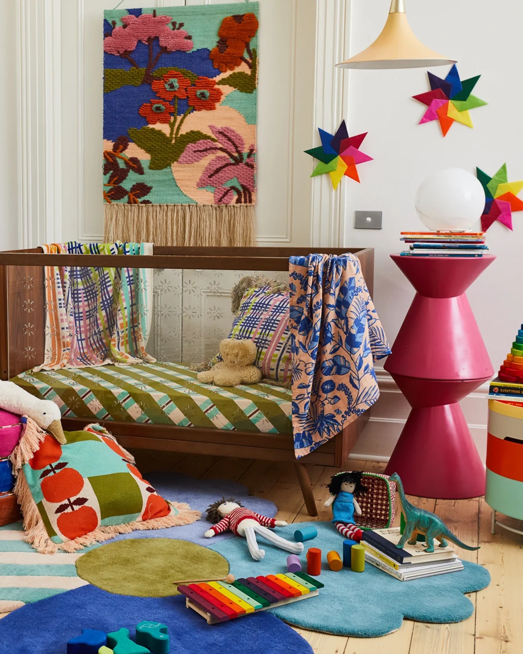 Childrens bedroom with cot and toys