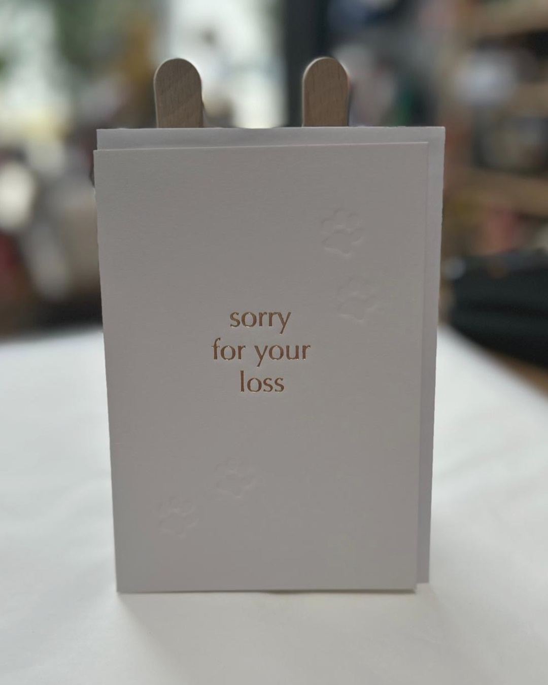 white card with sorry for your loss