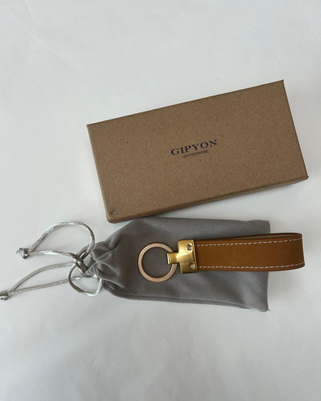 Suede leather tan coloured keyring with box