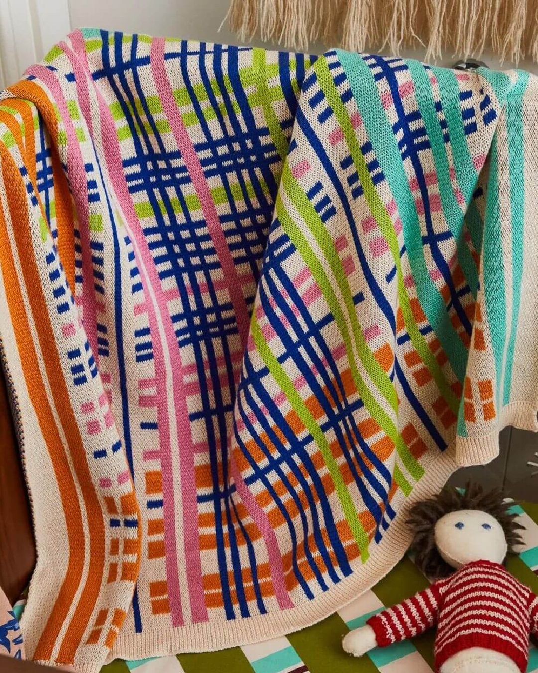 Mutlicoloured striped cot blanket