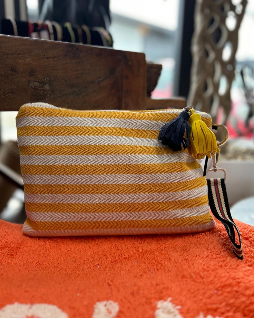 Striped yellow and white bag with tassel