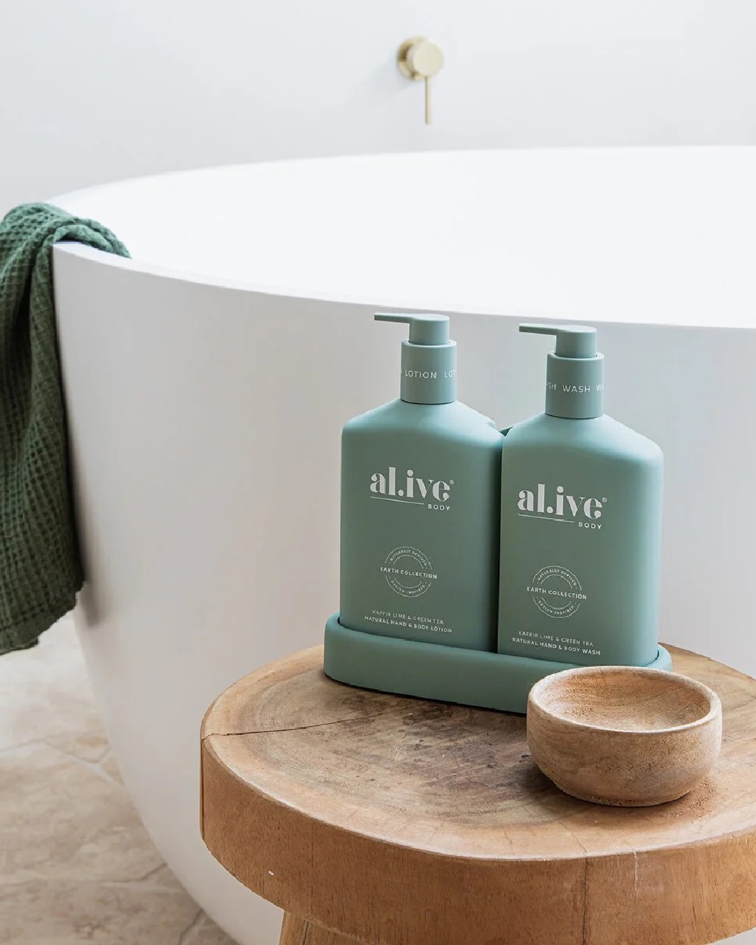 Al.ive wash and lotion duo in tray on stool